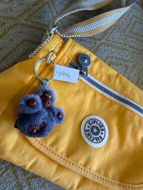 Kipling Yellow Kids Crossbody Bag with Gray Monkey Charm. Never used .